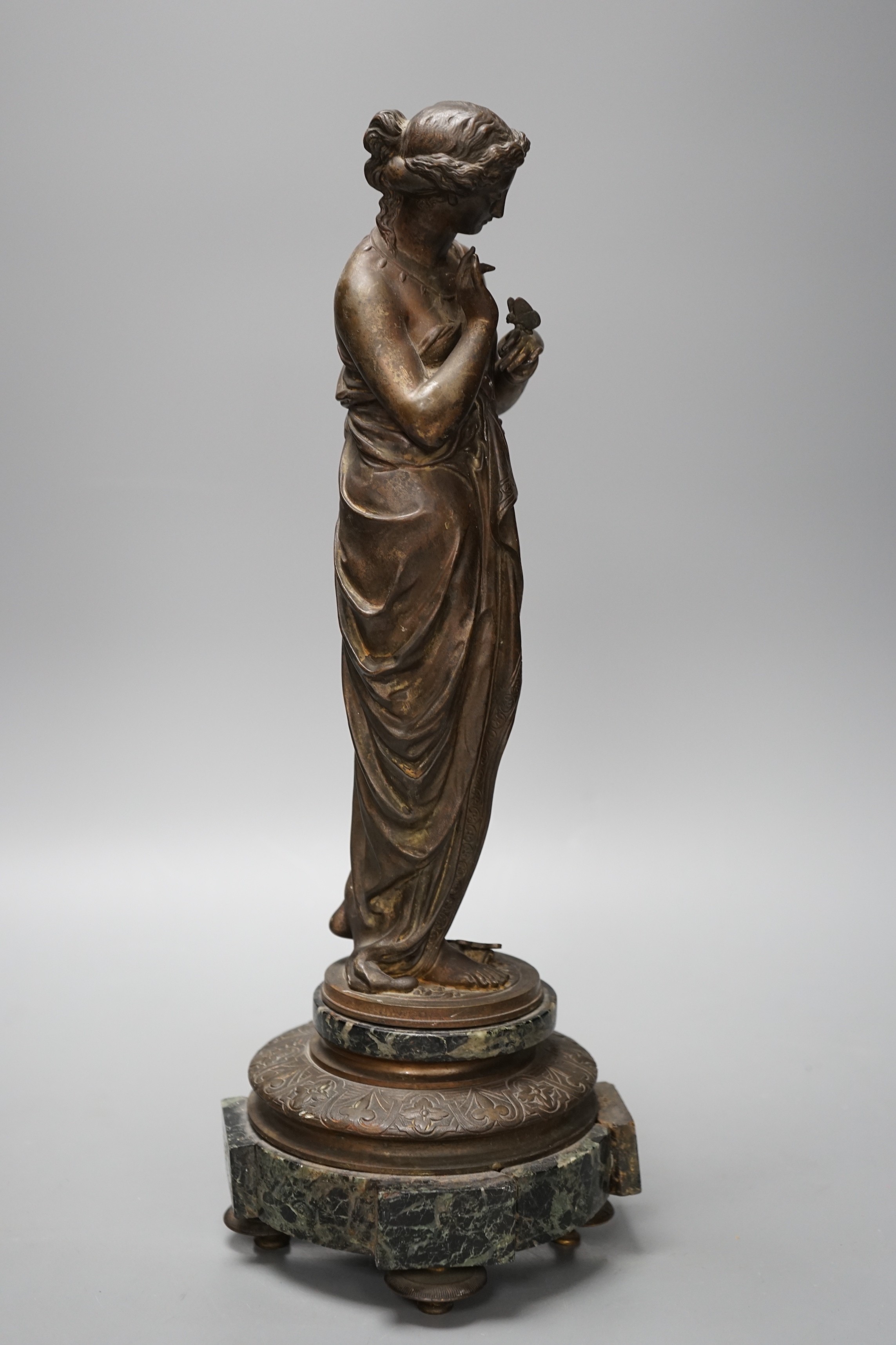 Émile Louis Picault (1833-1915), a bronze of a classical figure holding a butterfly, on marble base, 39cm